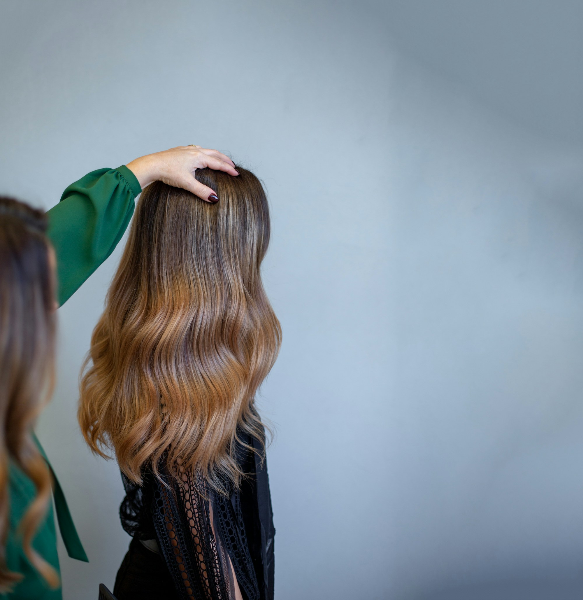 Glossy brunette waves with a warm, expensive-looking tone