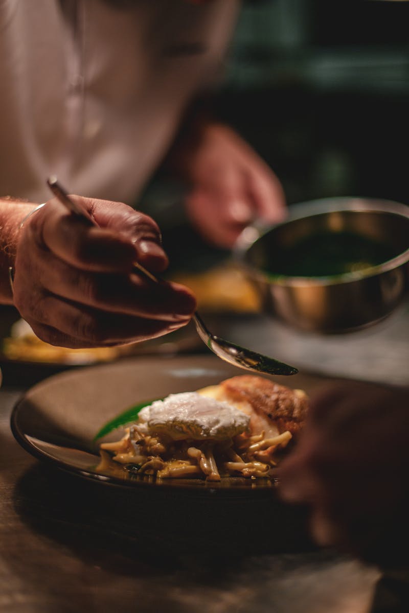 Chef plating a course